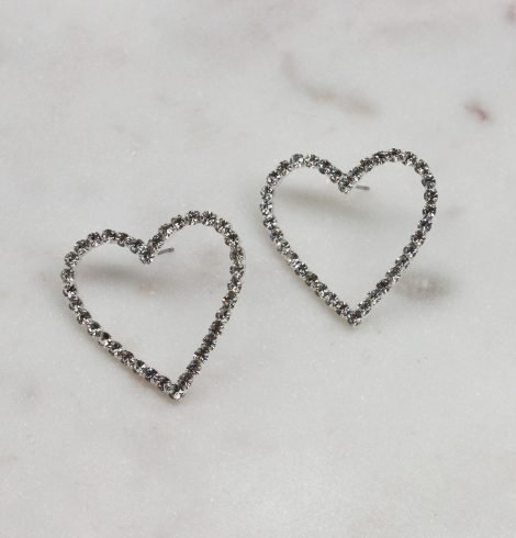 A photo of the Rhinestone Heart Earrings In Silver product