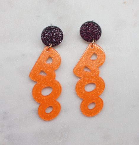 A photo of the BOO Earrings In Orange product