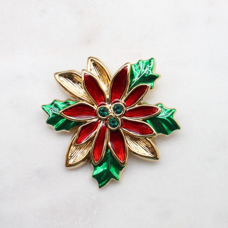 A photo of the Poinsettia Christmas Pin product