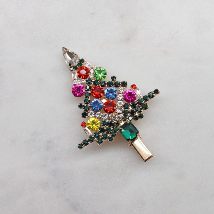 A photo of the Rhinestone Christmas Tree Hair Clip product