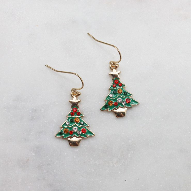 A photo of the Tiny Christmas Tree Earrings product