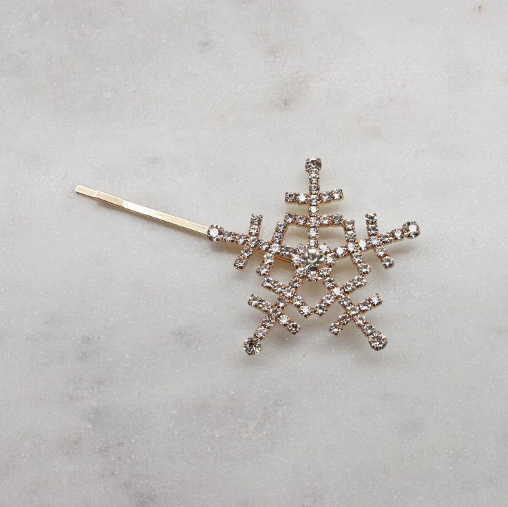 A photo of the Snowflake Hair Pin In Gold product