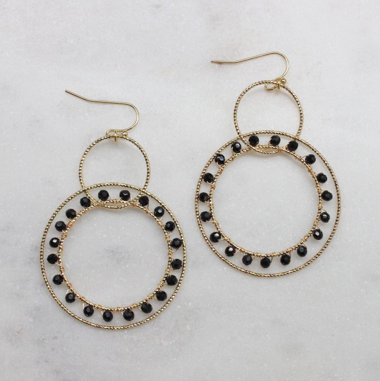 A photo of the Circle Around Earrings In Black product