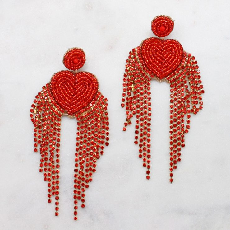A photo of the Dripping Hearts Rhinestone Earrings product