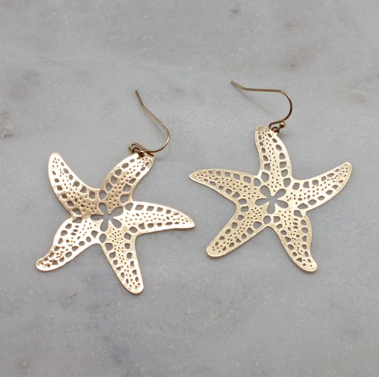 A photo of the Cutout Starfish Earrings product