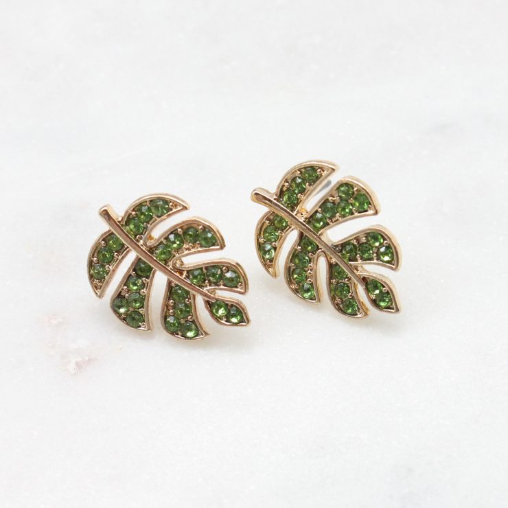 A photo of the Turtle Leaf Earrings In Green product