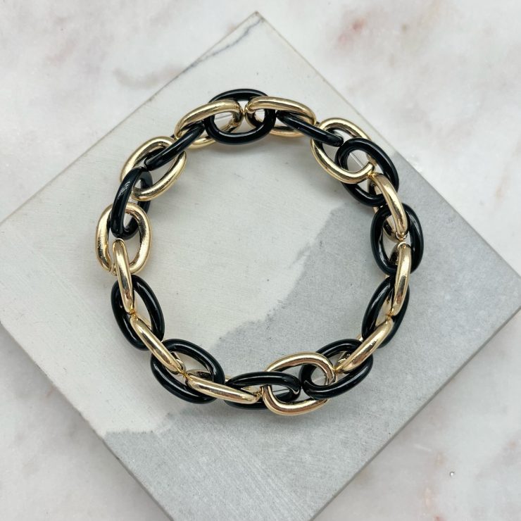 A photo of the Black & Gold Link Stretch Bracelet product