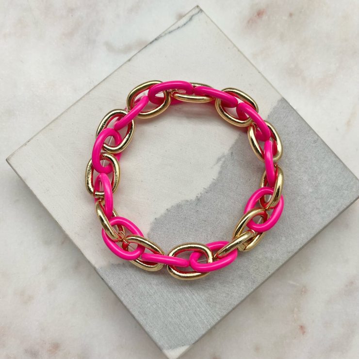 A photo of the Pink & Gold Link Stretch Bracelet product