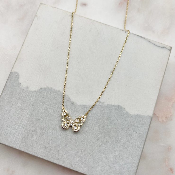 A photo of the Rhinestone Butterfly Necklace In Gold product