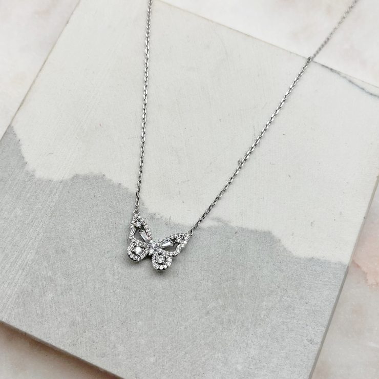 A photo of the Rhinestone Butterfly Necklace In Silver product