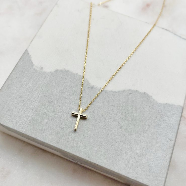 A photo of the Simple Cross Necklace In Gold product