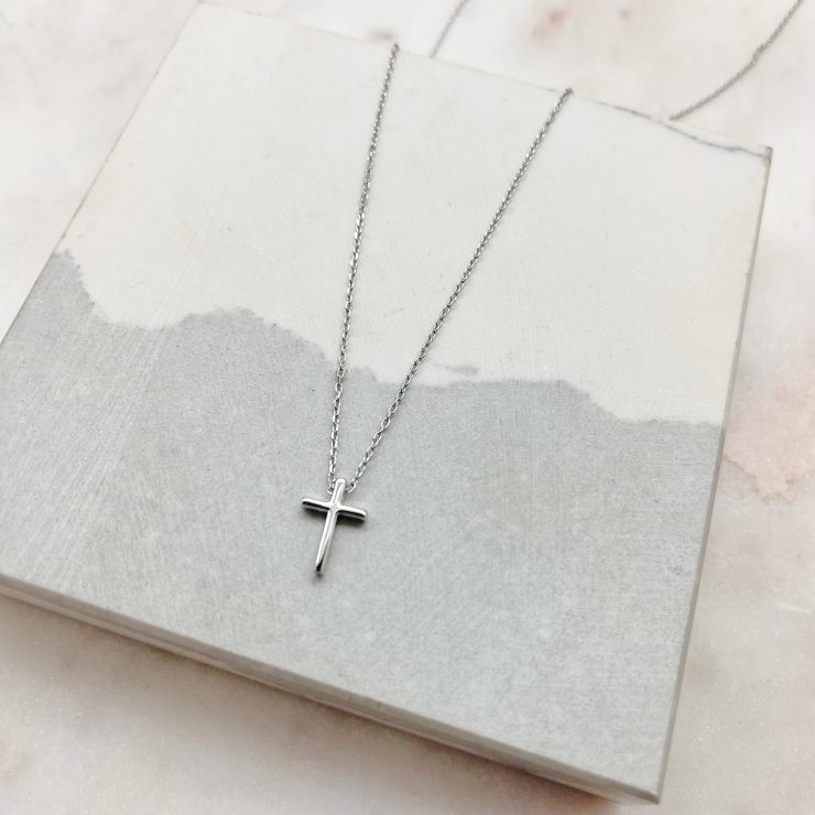A photo of the Simple Cross Necklace In Silver product