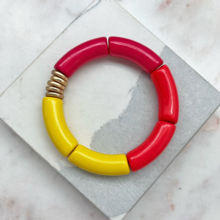 A photo of the Tube Stretch Bracelet In Strawberry Lemonade product