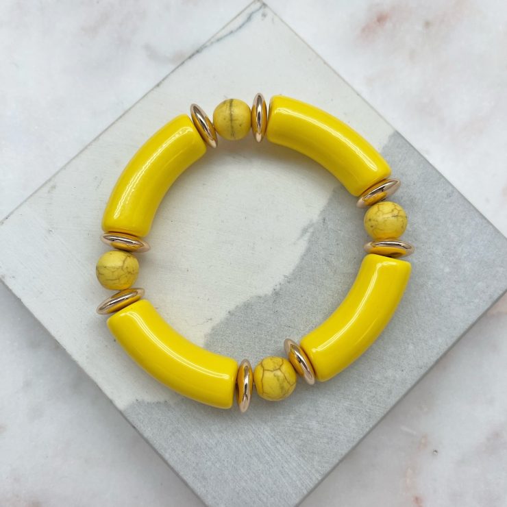 A photo of the Tube Stretch Bracelet In Yellow product