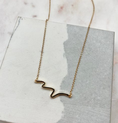 A photo of the Wave Necklace In Gold product