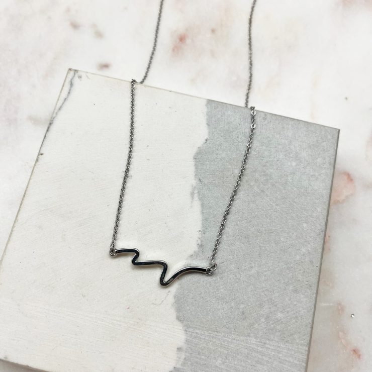 A photo of the Wave Necklace In Silver product