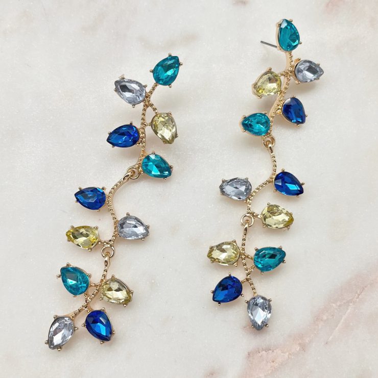 A photo of the All Of The Lights Earrings In Blue product