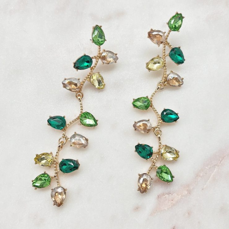 A photo of the All Of The Lights Earrings In Green product
