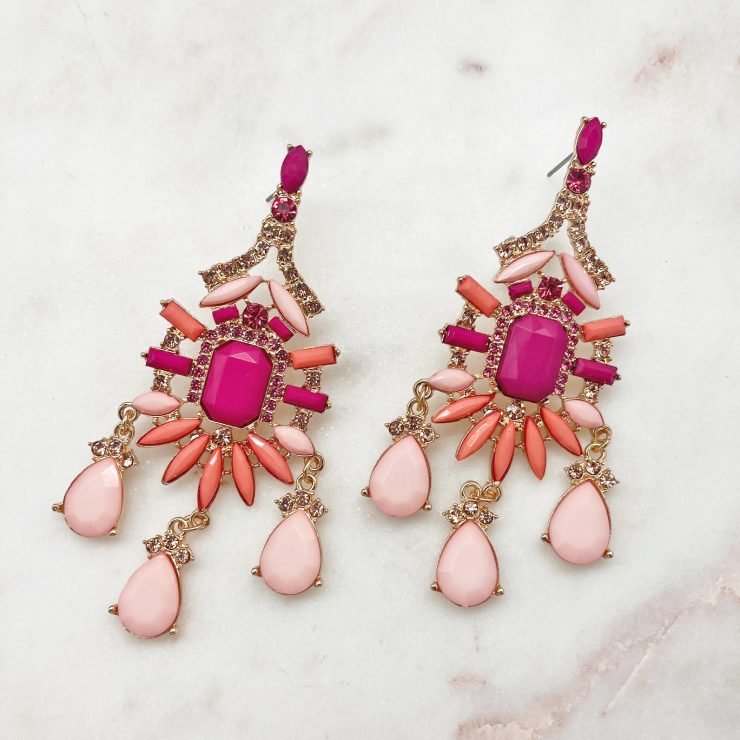 A photo of the Double Take Earrings In Pink product