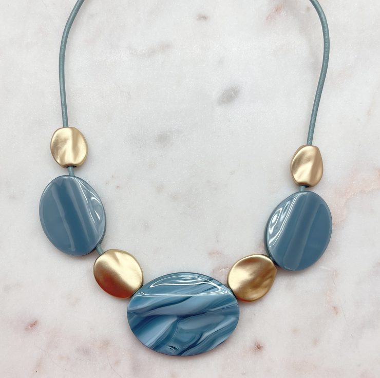 A photo of the Pebble Necklace In Blue product
