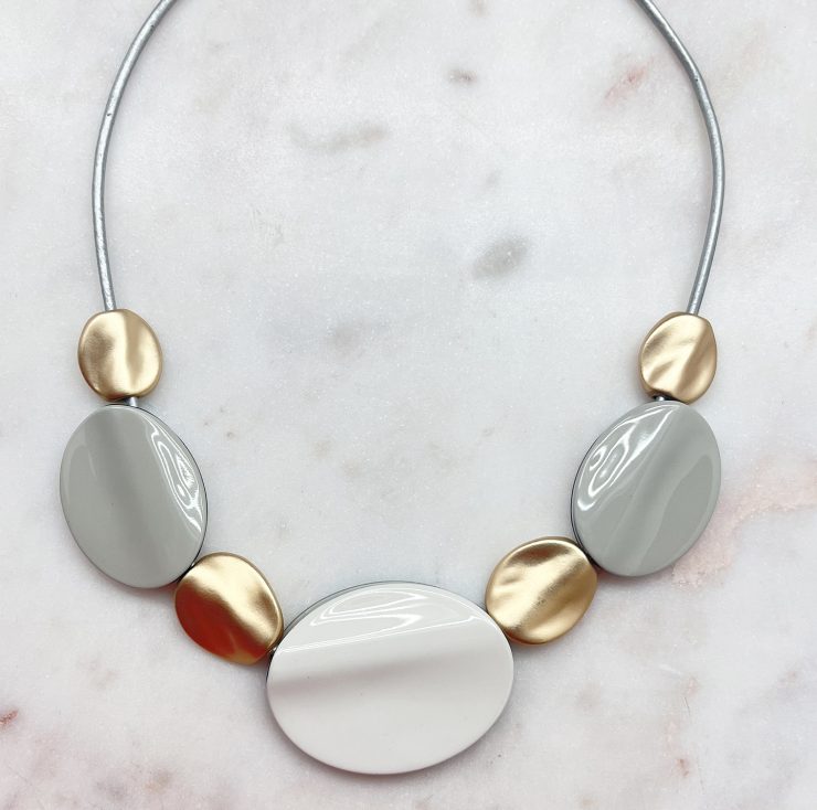 A photo of the Pebble Necklace In Grey product