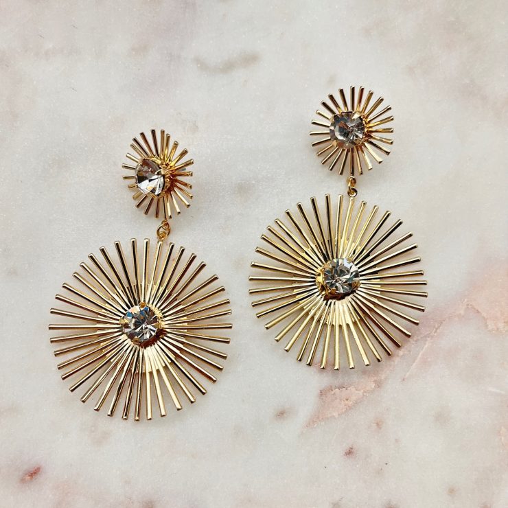 A photo of the Starburst Earrings In Gold product