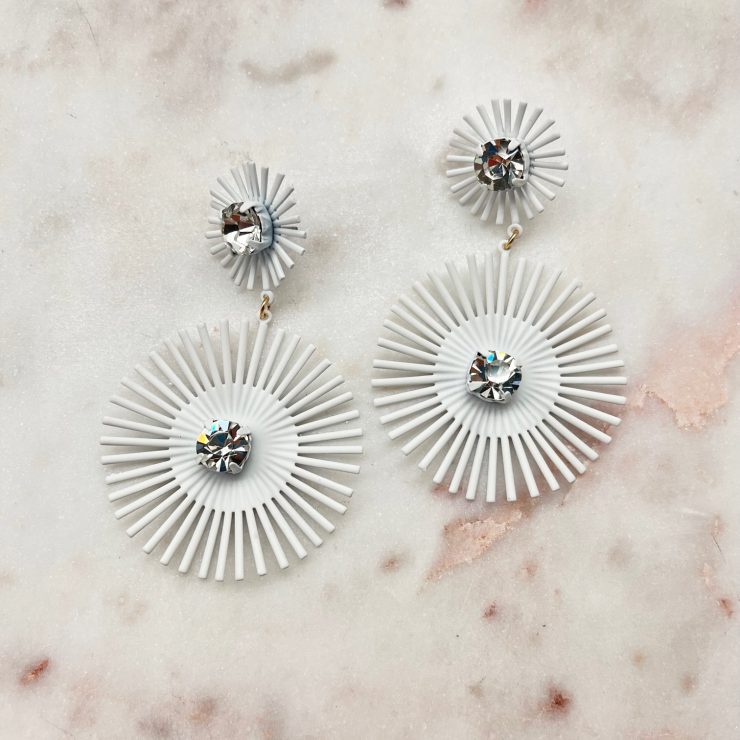A photo of the Starburst Earrings In White product