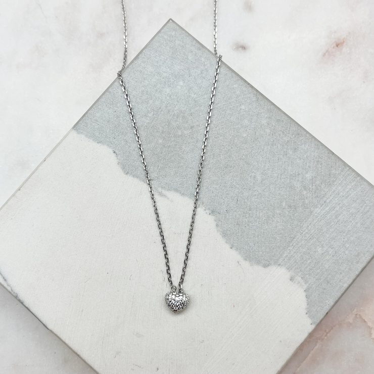 A photo of the Simple Heart Necklace product
