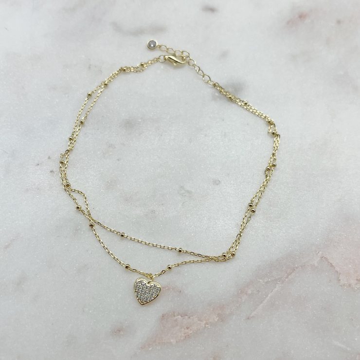 A photo of the Sterling Silver Gold Tone CZ Heart Anklet product