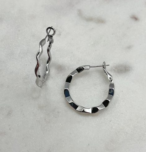 A photo of the Crinkle Hoop Earrings In Silver product