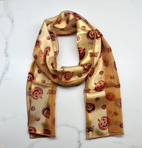 A photo of the Silky Jack-O-Lantern Scarf In Gold product