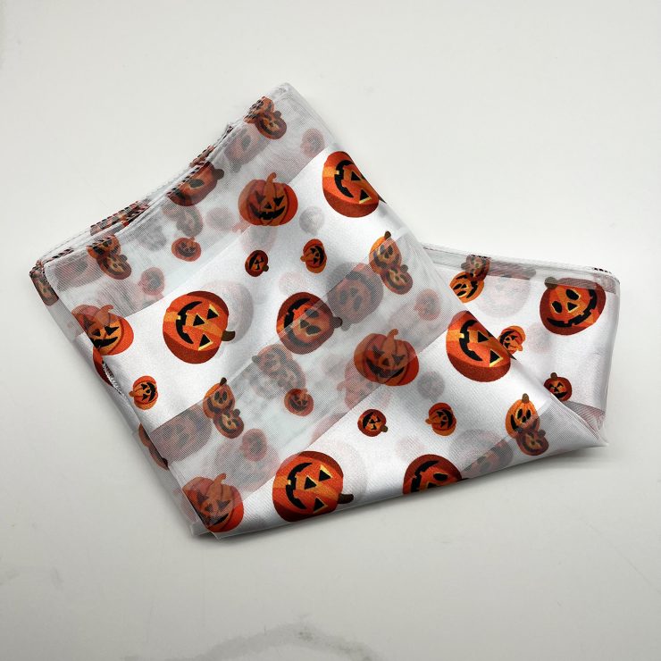 A photo of the Silky Jack-O-Lantern Scarf In White product