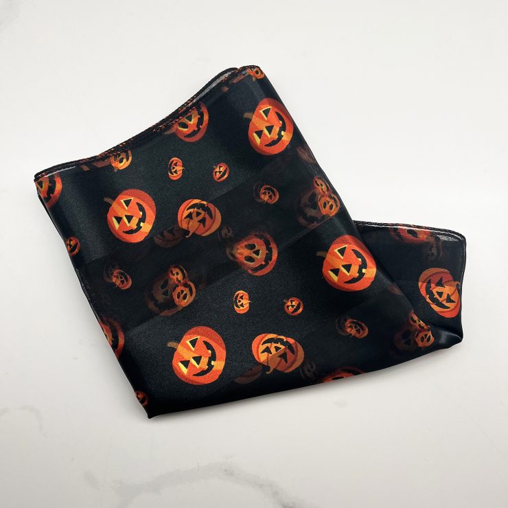 A photo of the Silky Jack-O-Lantern Scarf In Black product