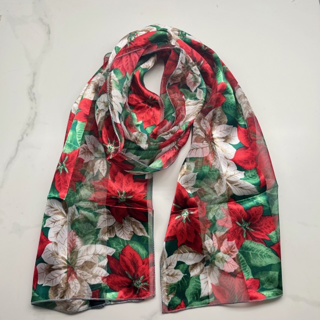 A photo of the Silky Poinsettia Scarf In White product