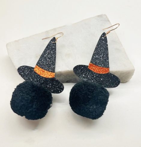A photo of the Witch Hat Pom Pom Earrings product