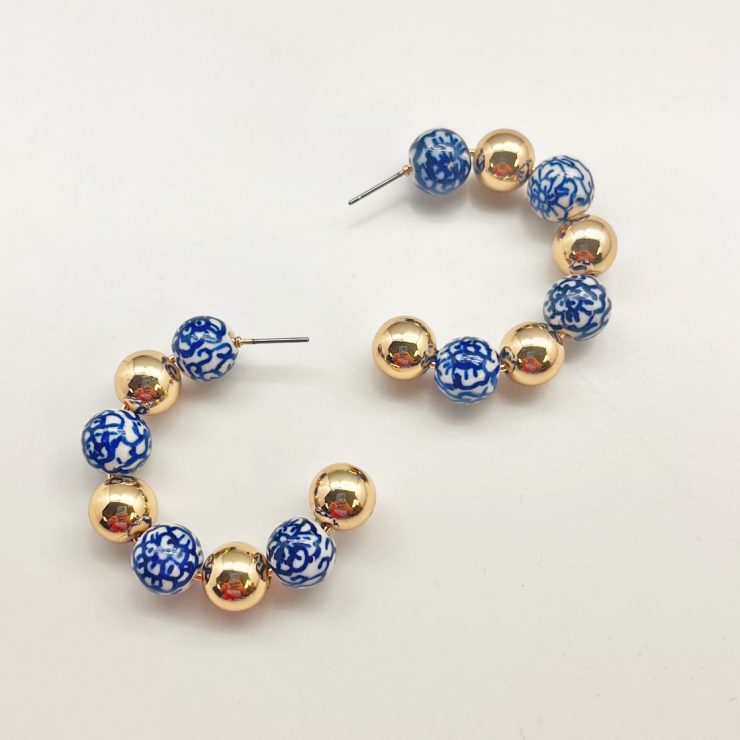 A photo of the Chinoiserie Hoop Earrings product