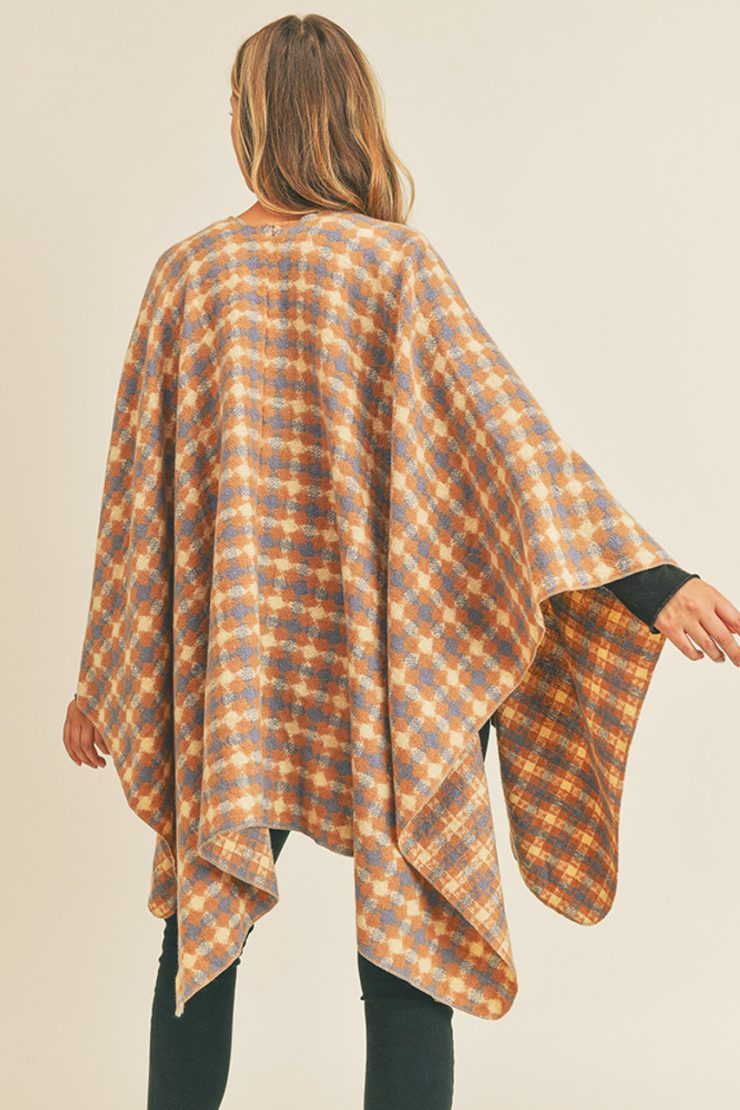 A photo of the Plaid Ruana In Rust product