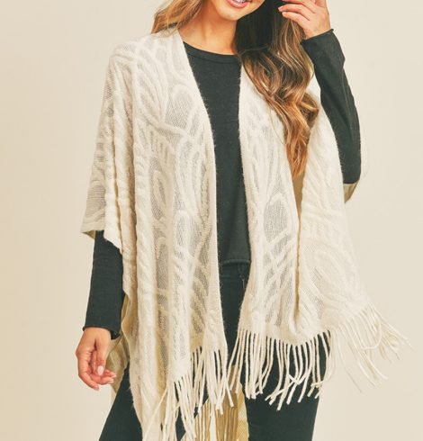 A photo of the Embossed Pattern Fringe Ruana In Ivory product