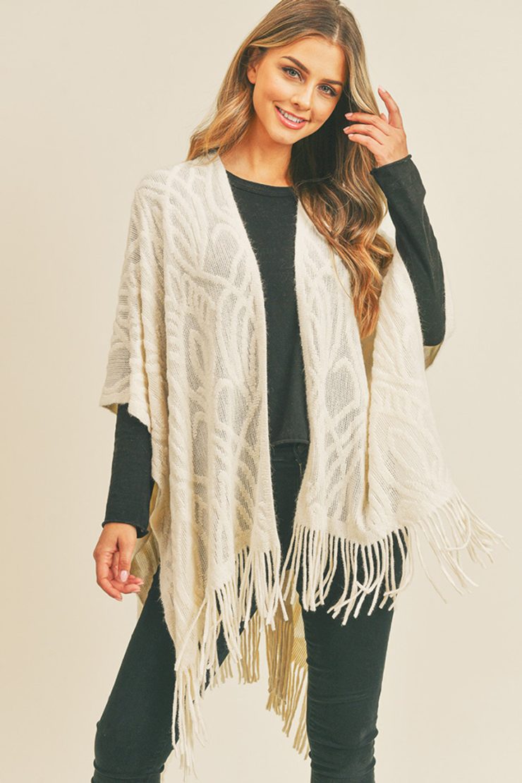 A photo of the Embossed Pattern Fringe Ruana In Ivory product