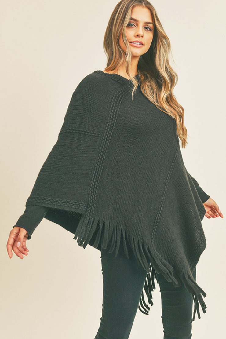 A photo of the Embossed Dotted Line Poncho In Black product