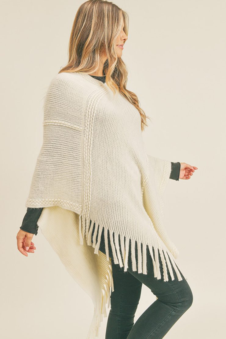A photo of the Embossed Dotted Line Poncho In Ivory product