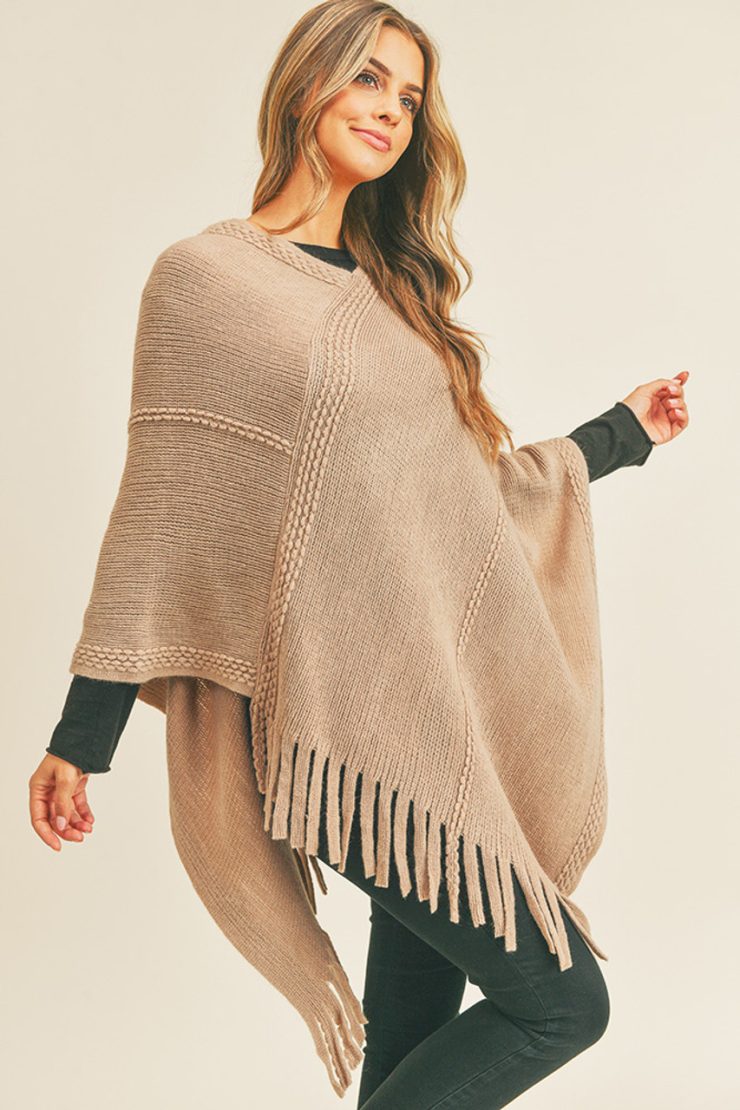 A photo of the Embossed Dotted Line Poncho In Taupe product