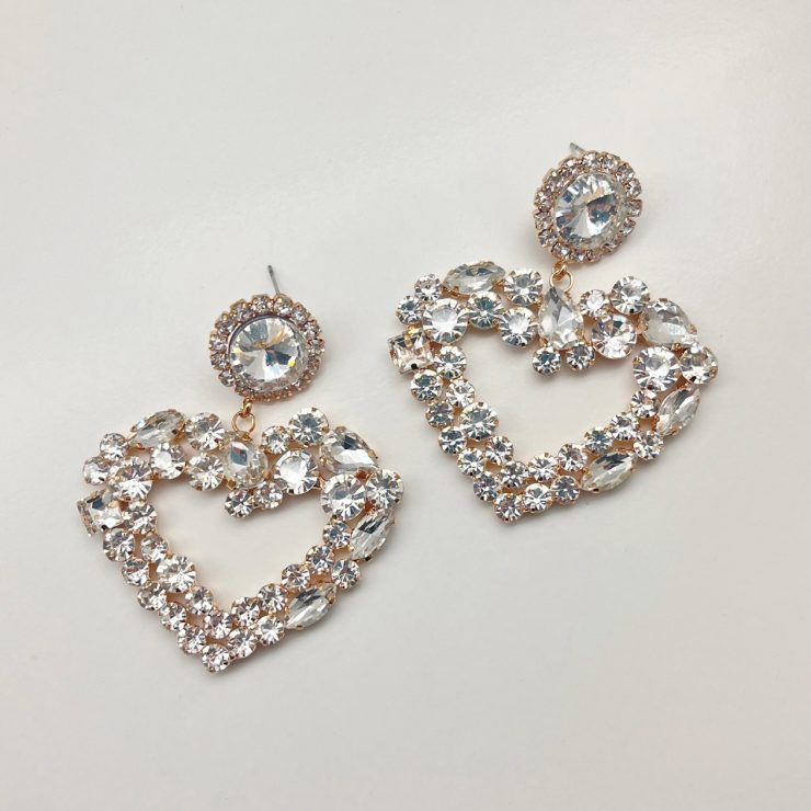 A photo of the Crystal Heart Earrings product