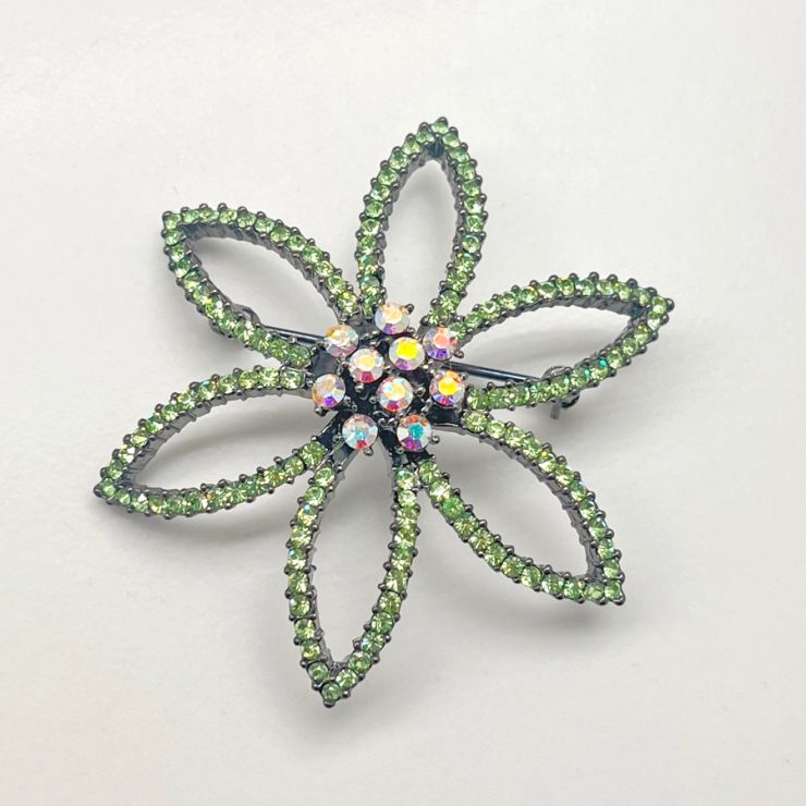 A photo of the Flora Rhinestone Pin In Green product