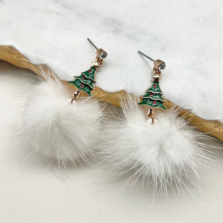 A photo of the Pom Pom Christmas Tree Earrings product