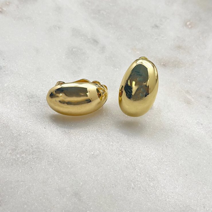 A photo of the Simple Oval Clip Earrings In Gold product