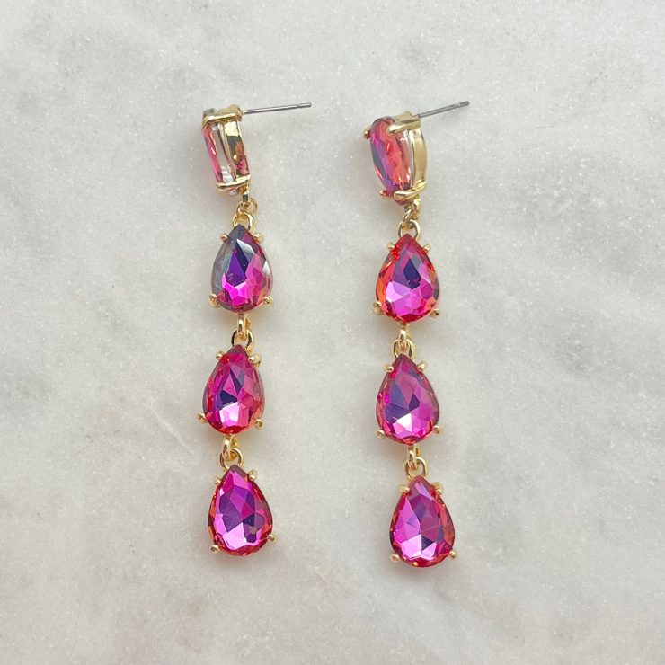 A photo of the Hidden Gem Earrings In Pink product