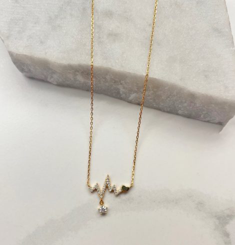 A photo of the Heartbeat Necklace In Gold product