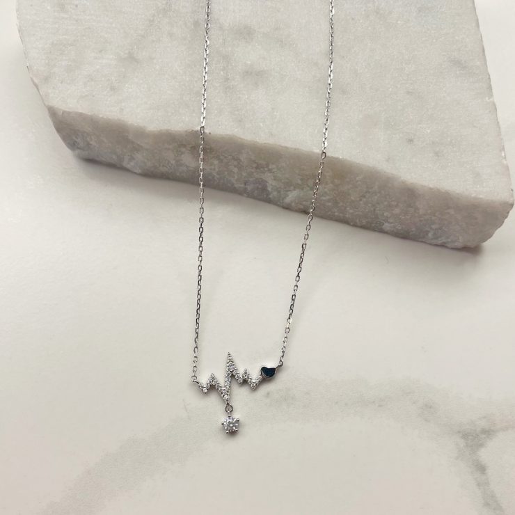 A photo of the Heartbeat Necklace In Silver product