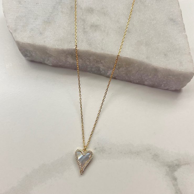 A photo of the Mother Of Pearl Heart Necklace In Gold product